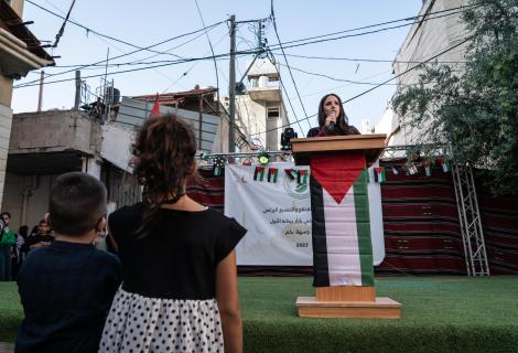 The Rise of Palestinian Women's Leadership in Refugee Camps, Shatha’s speaking at a Bazaar